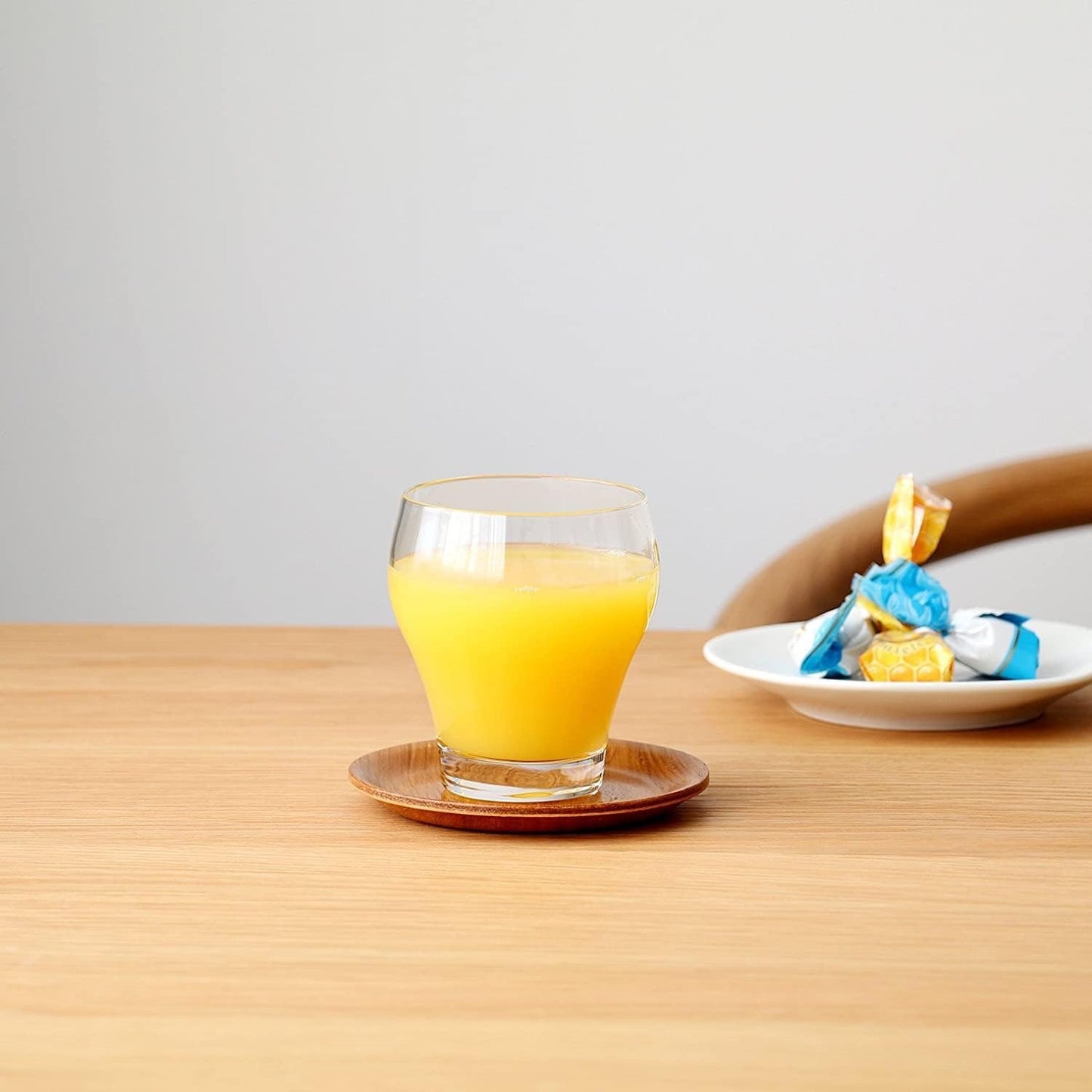 Aderia, clear glass water cup with orange juice