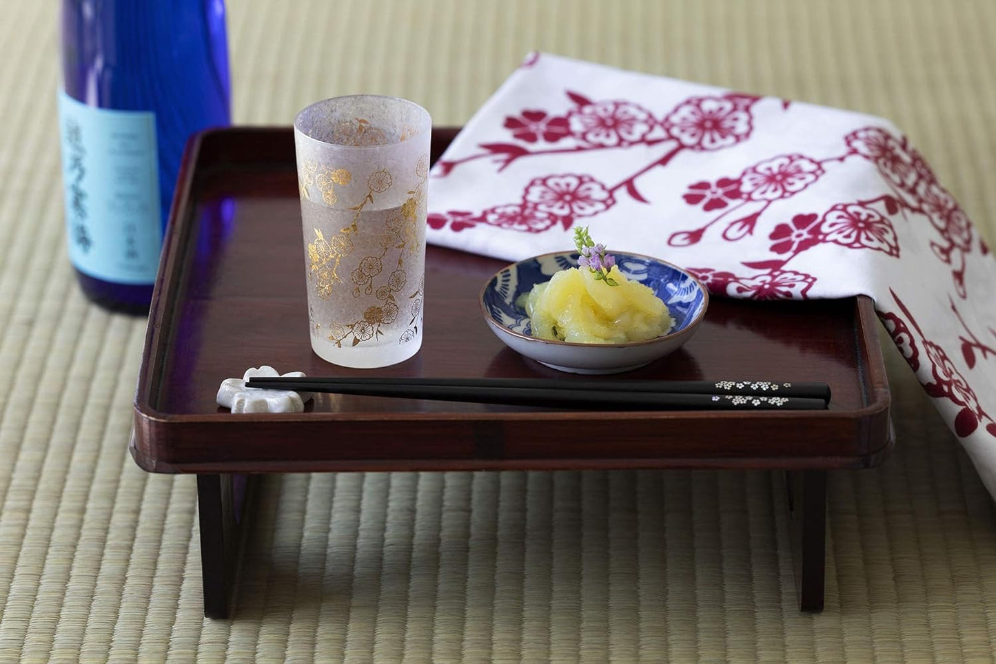 Aderia, A pair of cherry blossom-patterned cups and a piece of red and white cherry blossom-patterned cloth